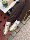 Kraftvolle Turnschuhe | Gold